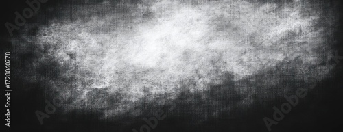 Abstract high contrast black and white textured background with cloudy and smoky visual effect