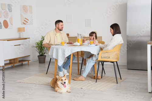 Happy family with Corgi dog...