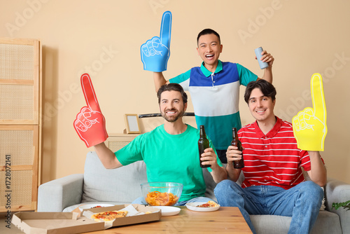 Male sports fans with foam ...