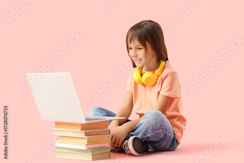 Cute little schoolgirl with...