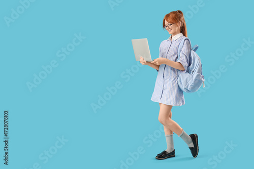 Cute schoolgirl with modern...