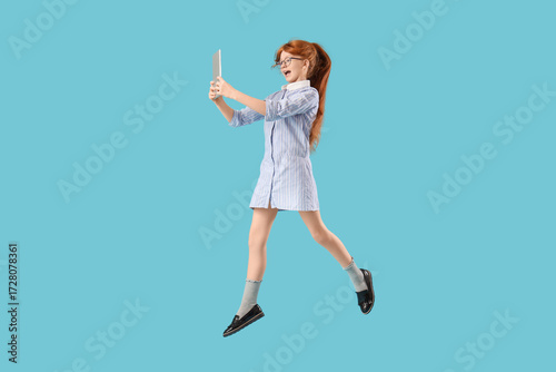 Cute schoolgirl with modern...
