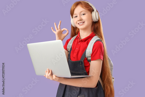 Cute schoolgirl with modern...