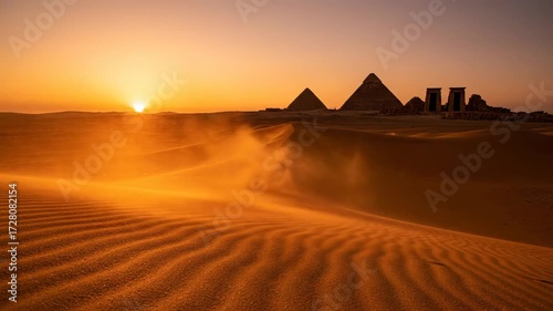 Sunset over desert pyramids. Sand dunes landscape with golden sunlight. Ancient monumental architecture and historic concept footage.