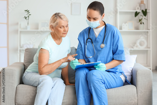 Senior woman with doctor si...