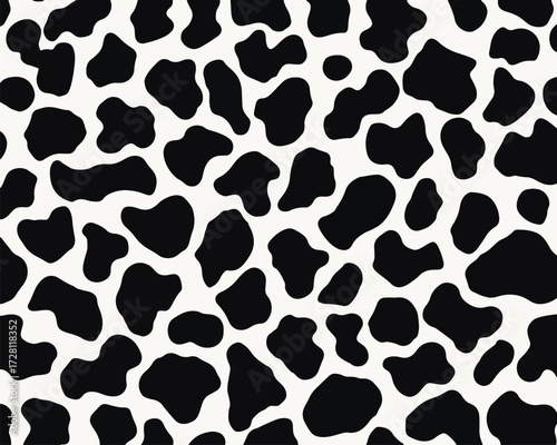 검은 얼룩무늬와 하얀 배경이 조화를 이루는 추상적인 패턴 디자인