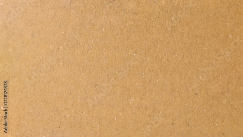 Background of brown kraft paper or cardboard texture. Abstract pattern of beige rough carton, old paper sheet.
