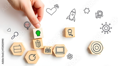 Flat lay honeycomb wooden blocks with business strategy icons and hand placing green lightbulb