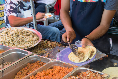 Preparing street food to sell tacos at a small stand in Guanajuato, Mexico.