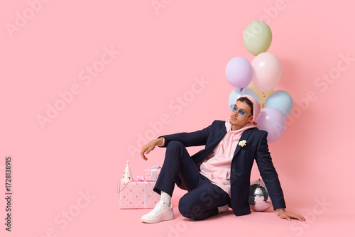 Cool young man celebrating ...