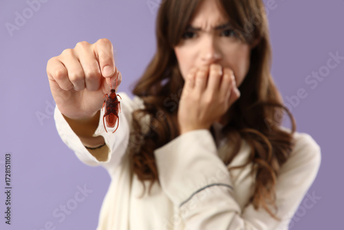 Scared young woman in pajam...