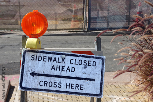 SIDEWALK CLOSED AHEAD - CROSS HERE sign