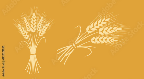 Golden wheat stalks and sprigs displayed with a simple silhouette