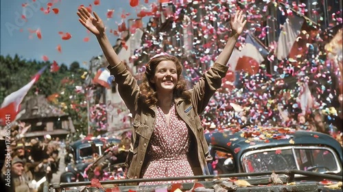 Confetti falls as woman rides 1940s parade car