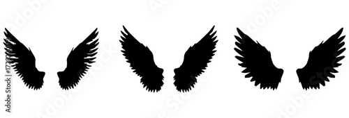 A Vector set of passion linear heraldic Icarus wings. Set of black angel or bird wings with feathers alignment. Design element for tattoo, logo or mascot. Birds Wings for background vector for logo.