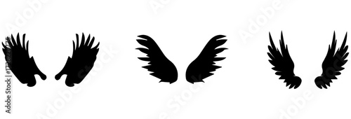 A Vector set of linear heraldic Icarus wings. Collection of black angel or bird wings with feathers alignment. Design element for tattoo, logo or mascot. Birds Wings for background vector for logo.