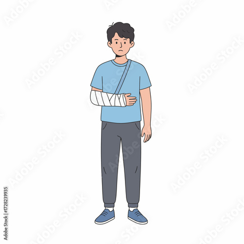 A sad young man stands with a broken arm in a white cast and a supportive blue sling.