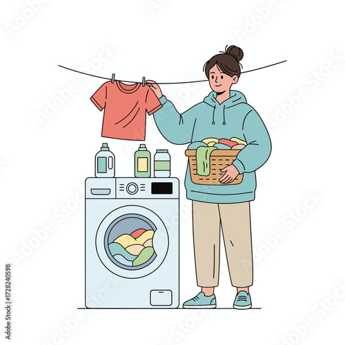 A woman does her laundry, hanging a clean t-shirt on a clothesline next to her washing machine.