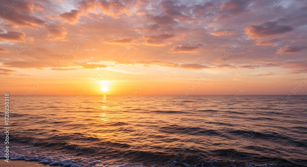 Obraz premium 水平線に沈む太陽が海を黄金色に染め上げるドラマチックな夕焼け風景 温かい光が雲と波を照らし出し息をのむ絶景が広がる. AI Generated