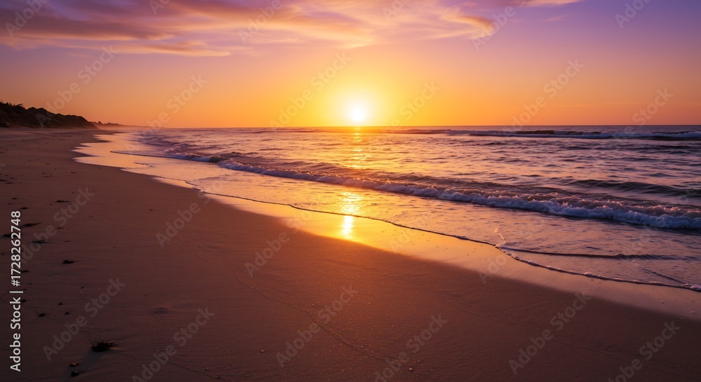 Fototapeta premium 鮮やかな夕焼け空が広がるビーチ黄金色の光が海面と砂浜を染め上げ波打ち際が煌めく美しい光景. AI Generated