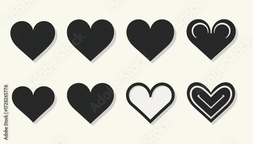A collection of eight black and white heart shapes with various designs on a light background.