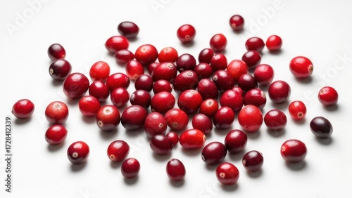 Cranberries scattered on white surface