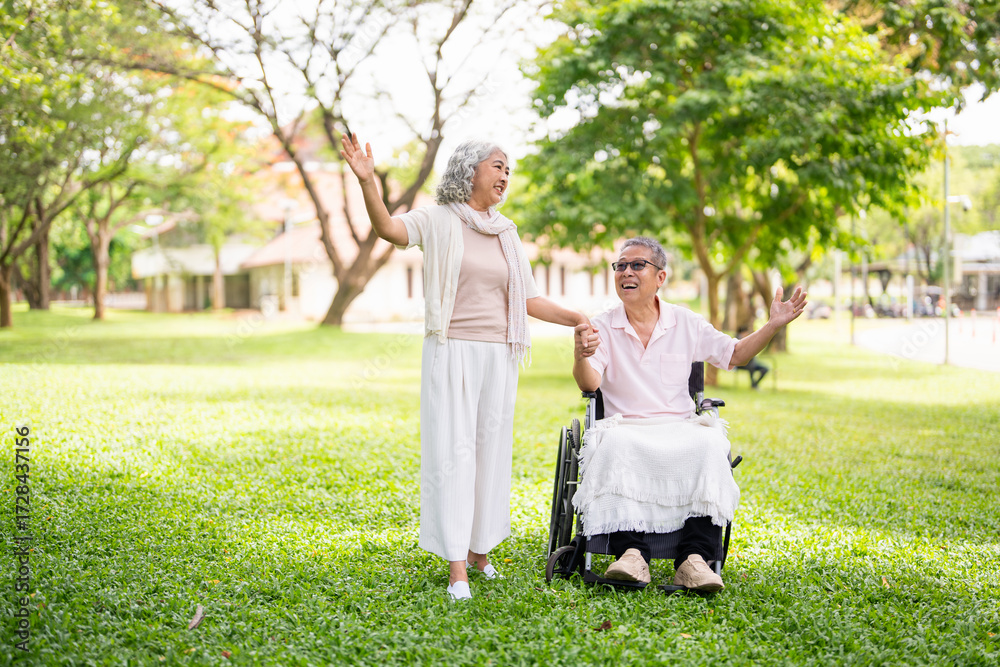 Fototapeta premium Senior, couple and people with disability in park for fresh air, walking and enjoyment of retirement or wellness with love. Man, woman and outdoor in garden for bonding, together and wheelchair.