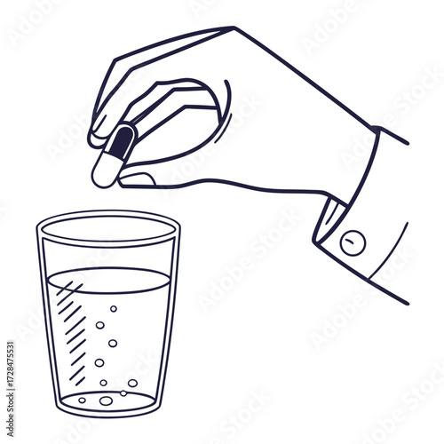 A hand in a suit sleeve is holding a capsule over a glass of water with bubbles symbolizing taking medication or supplements for health and wellness