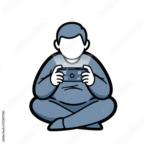 Person sitting crosslegged and engrossed in playing video game on handheld console, with soft glow emanating from the screen