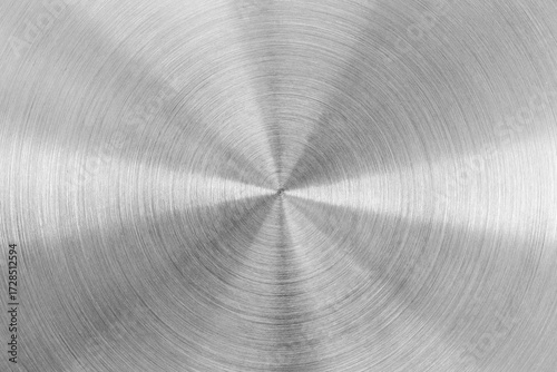 Circular brushed metal texture, silver metallic background.