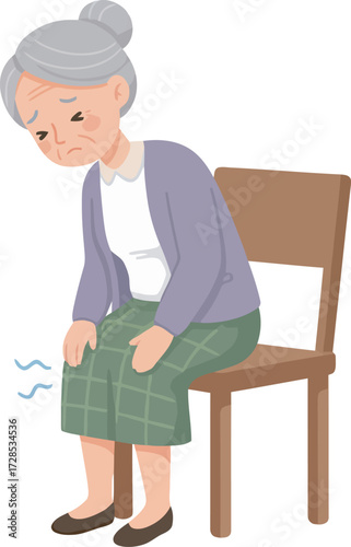 An elderly woman sits on a chair, holding her knee in pain, looking distressed.