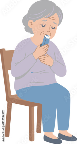 Elderly woman seated, using an inhaler for respiratory relief, feeling unwell, and suffering.