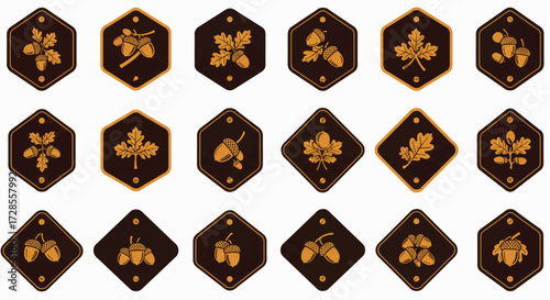 Golden oak leaves and acorns arranged in decorative badges, emblems, and symbols on a dark brown surface create a vintage and elegant aesthetic.