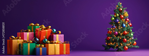 Gift boxes and a decorated multicolored Christmas tree stand against a purple studio background with copy space