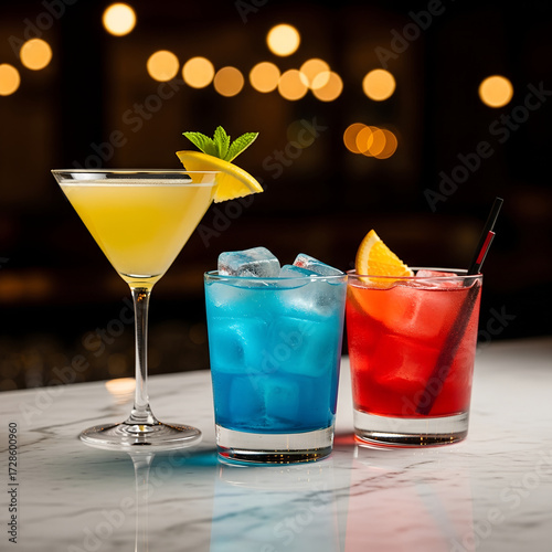 Cold alcoholic cocktail drink with ice and lime in a glass on a bar table