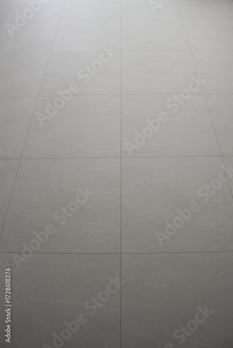 The living room has a beige hardwood floor.	