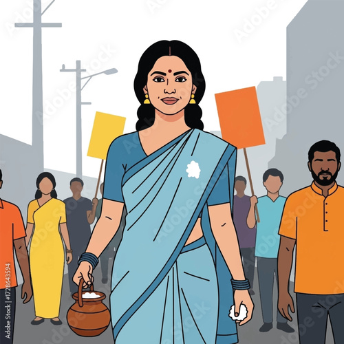 A woman in a blue sari leads a diverse group of people holding protest signs in a city street.