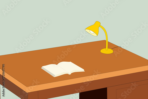Desk with a book and lamp.