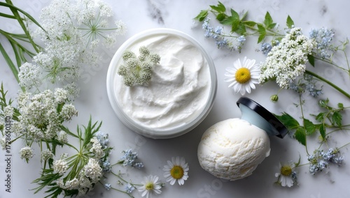 A delicate arrangement of botanicals, a creamy moisturizer, and a scoop of refreshing ice cream on a light marble surface.