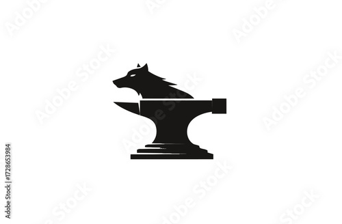 Silhouette of a wolf's head resting on a stylized anvil in black and white