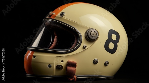 Vintage racing helmet displayed with striking orange and black design highlighting number 8