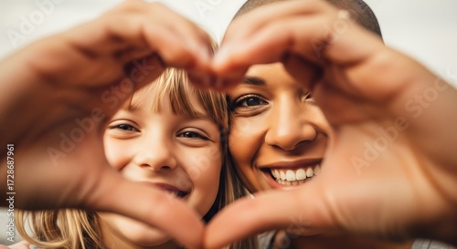 Mother and Child Expressing Love with Heart Hands