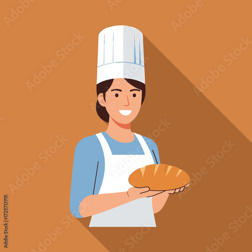 A smiling female baker in uniform holds a freshly baked loaf of bread.