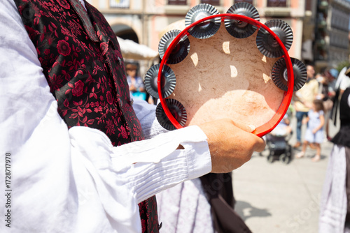 Galician musician holding a tambourine