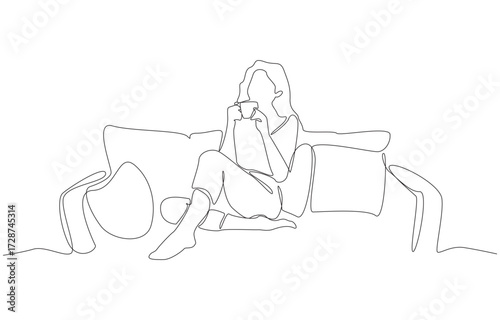Continuous one line drawing of woman drinking coffee and relaxing on sofa, single line art.