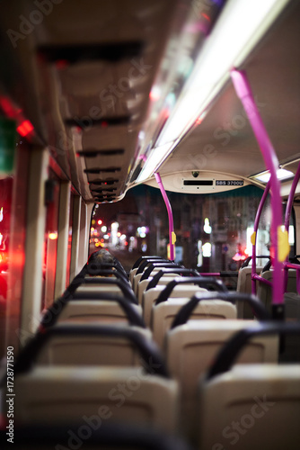 Man Seating in front in a double decker bus