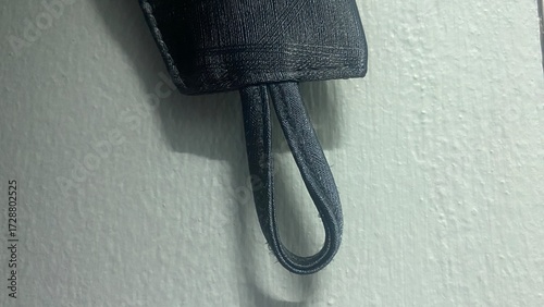 Obraz na plátně close up of a black belt on white background