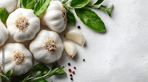 Wallpaper Mural Several bulbs of fresh garlic with aromatic herbs lie on a textured white surface in natural daylight studio Torontodigital.ca