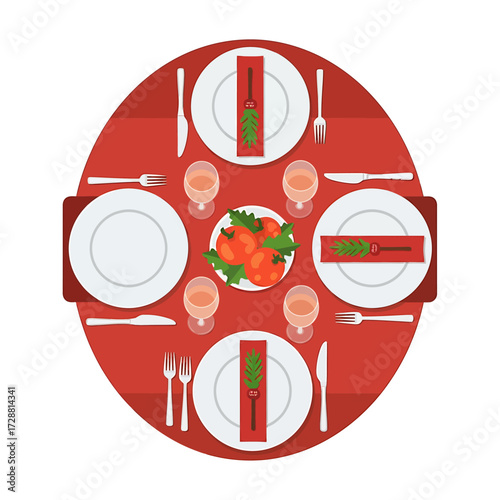 A top-down view of a round dining table set for four people with plates, cutlery, glasses, and a centerpiece of tomatoes and greens.