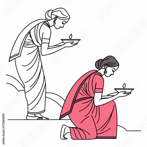 Two indian women in traditional attire holding diyas with lit flames one standing and one kneeling symbolizing light and cultural celebration